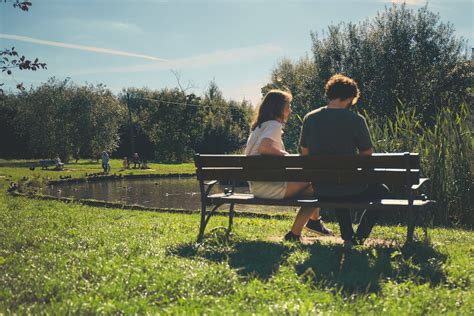 Two Girl and Boy Sitting on Bench Outdoor · Free Stock Photo