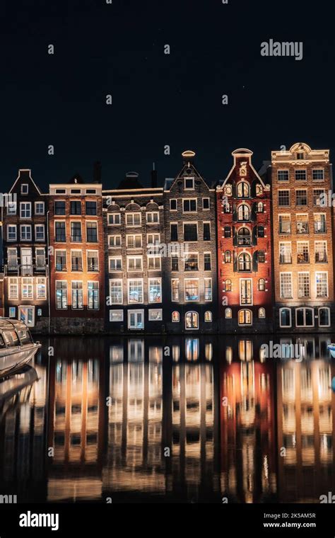 Dancing Houses Damrak Amsterdam during the night Netherlands Holland ...