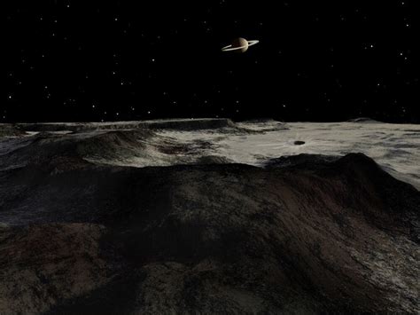 Saturn seen from the surface of its moon, Iapetus. Iapetus is divided ...