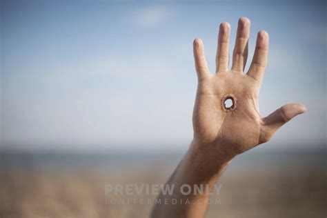 Raised Hand With Hole In It. - Stock Photos | Pearl