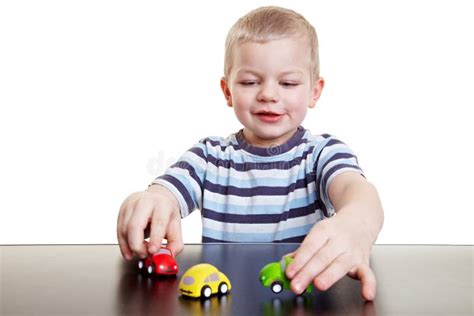 Little Child Playing with Cars Stock Image - Image of imagination, shot: 19033117