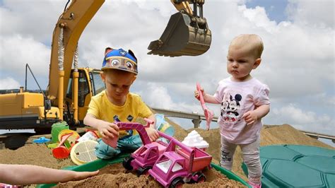 Pink excavator and truck toys: Little girl plays in little tikes turtle ...