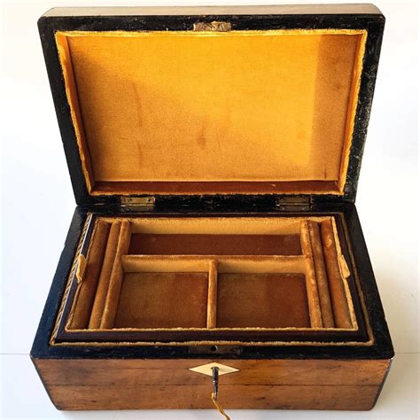 Antique Victorian Jewellery box with inlaid on the top and in front at key.