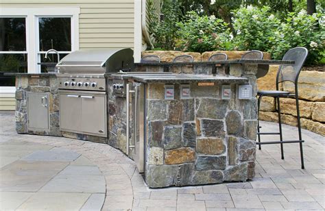 An Outdoor Cooking Station Completes a Stunning Backyard Oasis | Yardmasters Landscaping Company