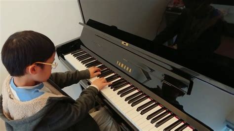 A 7 year old boy with an impressive talent on the piano | VideoMan