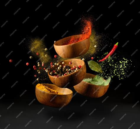 Premium Photo | Spices and seasonings powder splash explosion on black background