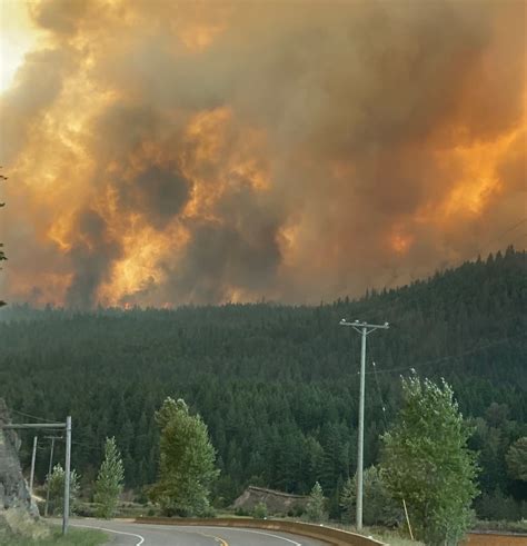 Spurred by strong winds, aggressive fire at White Rock Lake jumps highway, burns homes | CBC News