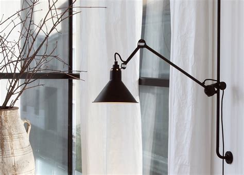 The Le Lamp Gras No 214 is an articulated wall lamp which is height adjustable along and ...