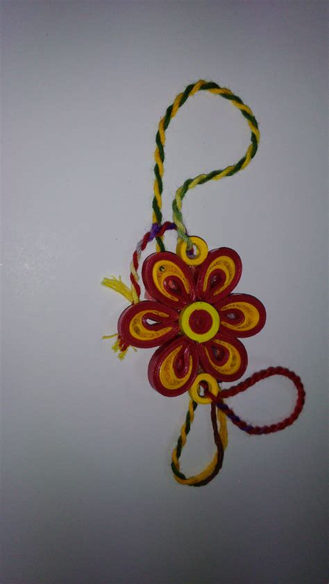 Beautiful yellow and red handmade rakhi made by paper quilling. (With ...