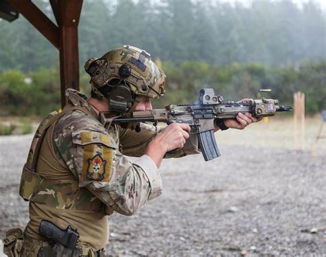 A Canadian Special Operations Regiment (CSOR) soldier fires his C8 ...