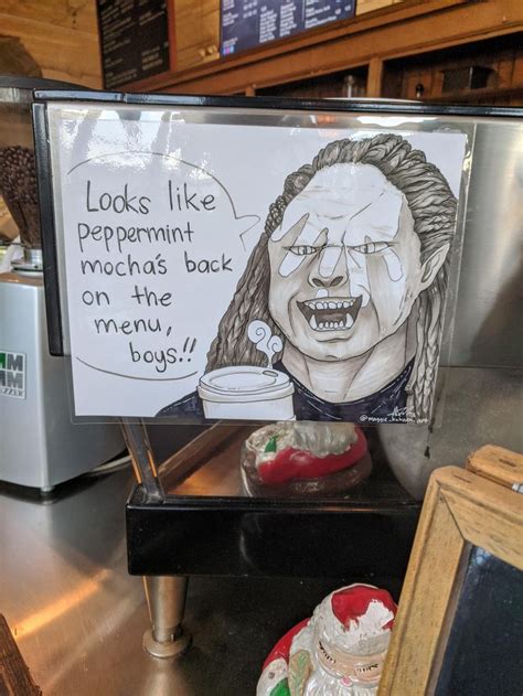 a sign with a drawing of a woman holding a coffee cup in front of her face