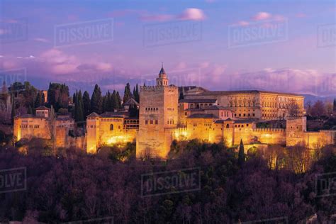 View of the Alhambra, UNESCO World Heritage Site, with the Sierra Nevada mountains in the ...