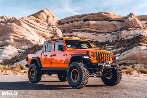 Orange Gladiator Jeep | Modren Ledge Offroad | WELD Wheels