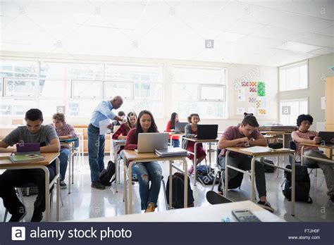 High school students digital tablets and laptops classroom Stock Photo - Alamy