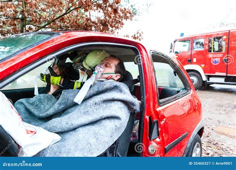 Accident - Fire Brigade Rescues Victim of a Car Stock Image - Image of ...