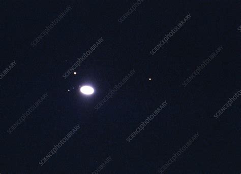 Photograph of Saturn and moons through telescope - Stock Image - R390 ...