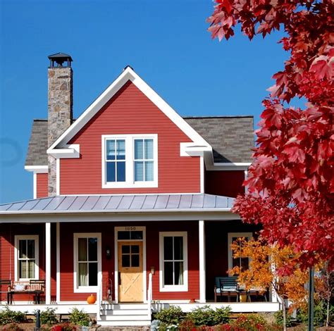 Barn red farm house with metal roof. | Red house exterior, Red barn house, Red farm house