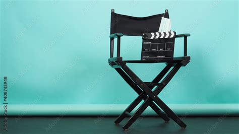 BLACK director chair with Clapperboard or movie Clapper board and face mask on green or Tiffany ...