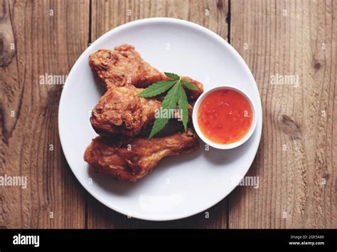 Crispy fried chicken food with cannabis leaf - marijuana leaves plant ...