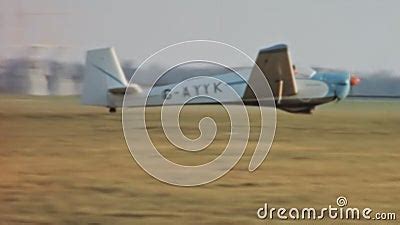 Vintage Motor Glider Takeoff Run from an Airport with Grass Runway in ...