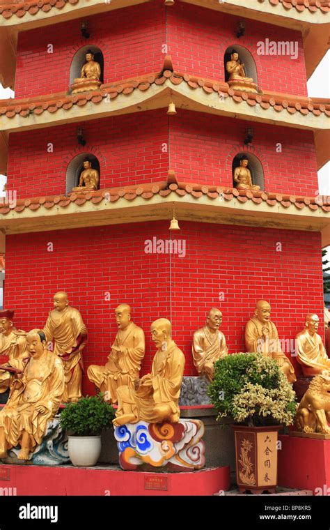 Buddha statues at the base of the pagoda at the Ten Thousand Buddha Monastery, Sha Tin, Hong ...
