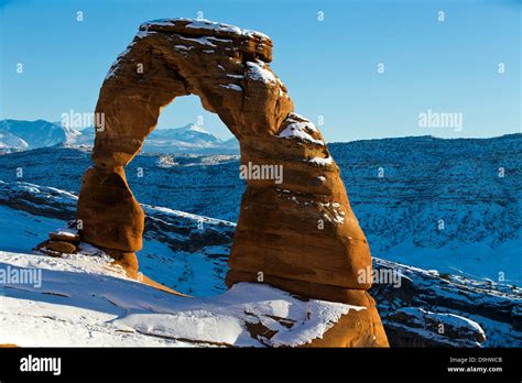 Delicate Arch with snow in winter at sunset, Arches National Park, Utah, United States of ...