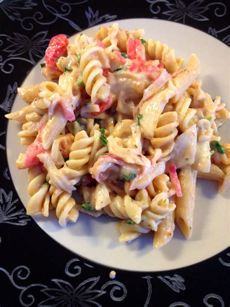 Easy dinner! Pasta, imitation crab, Alfredo sauce, tomato sauce, spinach! Took eleven minutes ...