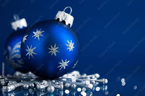 Blue christmas ornaments on blue background. Merry christmas greeting card, banner. Winter ...