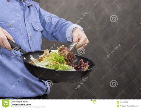 Young Man Cooking Healthy Food in the Kitchen. Stock Photo - Image of ...