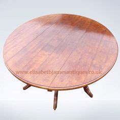 ROUND ANTIQUE DINING TABLES