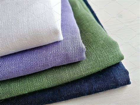 Pile of linen fabrics. by otabalyuk on @creativemarket Linen Jumpsuit ...