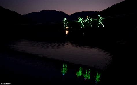 Chinese park launches retro glow-in-the-dark lake drift experience | Daily Mail Online