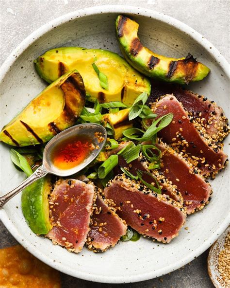 Major summertime vibes with this sesame seared ahi tuna & grilled avocados (tossed in a ginger ...