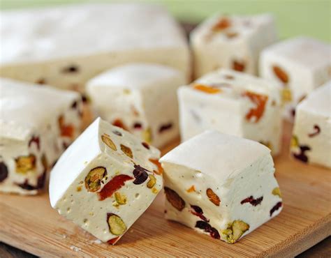 White Chocolate Nougat is a soft, fluffy homemade nougat with a sweet vanilla-white chocolate ...