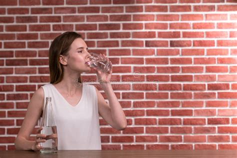 Young Woman Drinking Water from Glass in the Room Stock Photo - Image of glass, people: 131842776