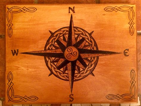 Wood burning, compass rose with a Celtic Solomon knot weave around the center with Celtic knot ...