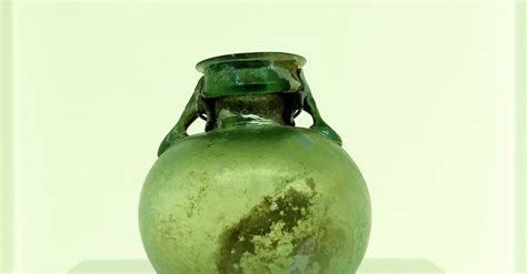 Green Glass Vase on White Surface · Free Stock Photo