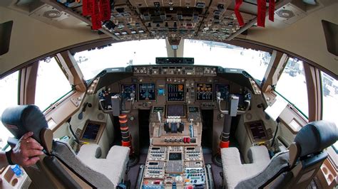 The Boeing 747-8JK cockpit is filled with pretty buttons and switches