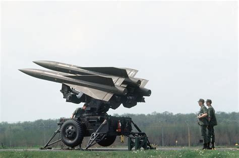 US Army soldiers inspect MIM-23B Hawk missiles on a towed launcher ...