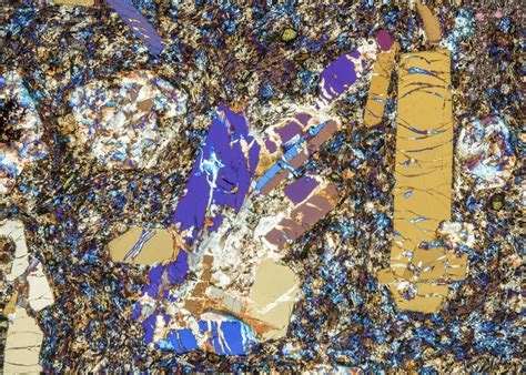 Phonolite mineral rock crystals, polarised light micrograph - Stock ...