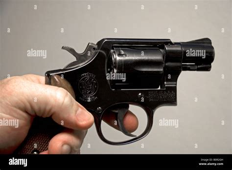 Finger on the trigger of a Smith and Wesson 38 caliber snub nose ...