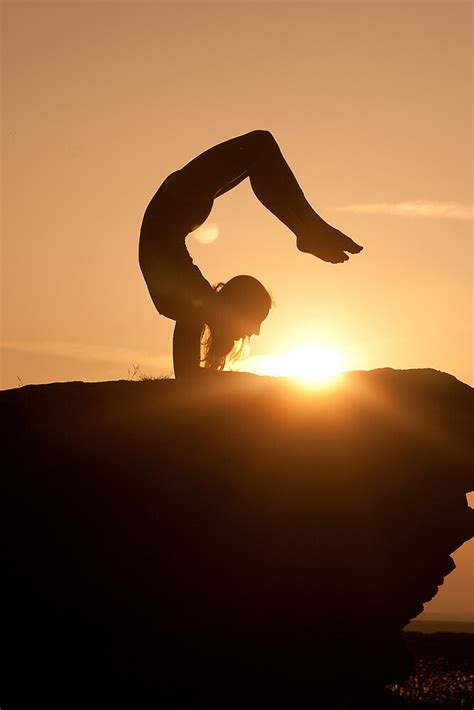 "Yoga Poses at Sunset 5" by JonWHowson | Redbubble