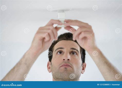 Man Fitting Spotlight in Ceiling Stock Image - Image of install, electric: 121238805
