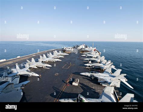 US Navy fighter aircraft line the deck of the Nimitz class super ...