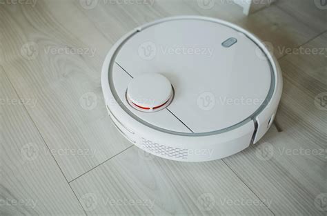 white robot vacuum cleaner 5699639 Stock Photo at Vecteezy