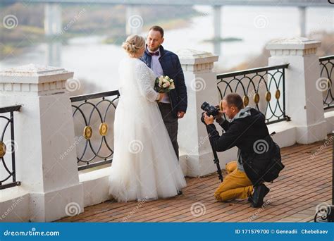 Wedding Photographer Taking Pictures of the Bride and Groom on Park Alley Stock Photo - Image of ...