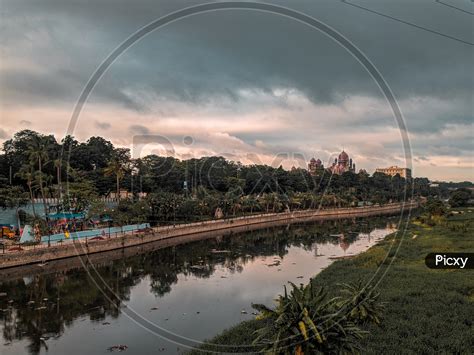 Image of Musi River Channel With Dark Clouds Background At Chaderghat Hyderabad-EF373377-Picxy