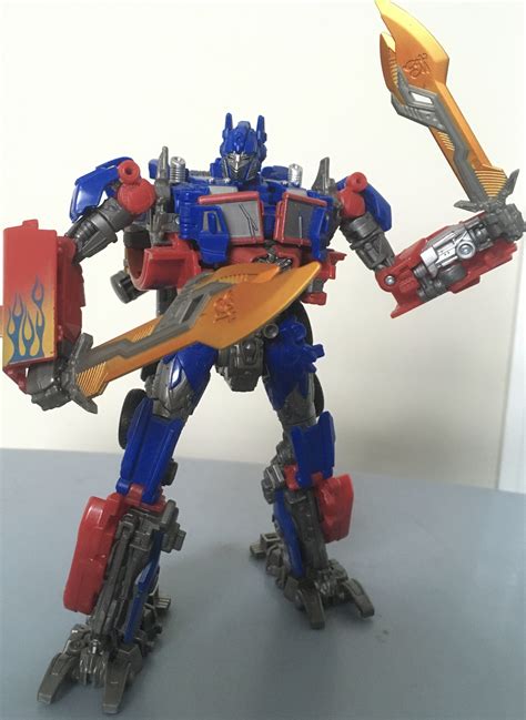 Optimus Prime with two swords by SuperHeroTimeFan on DeviantArt