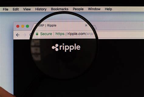 Magnifying glass over Ripple logo - Creative Commons Bilder
