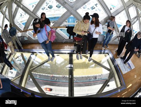 Tourists take pictures inside the tower bridge in London, England, 20 ...